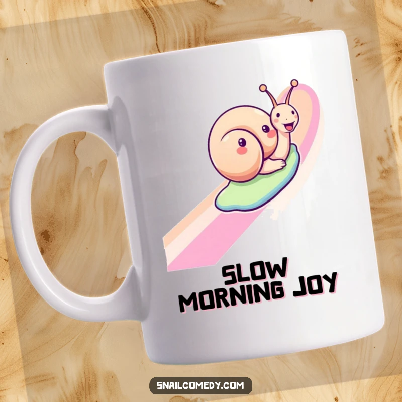 Funny snail mug featuring a joyful snail sliding down a rainbow, a humorous and cheerful gift for slow living enthusiasts.