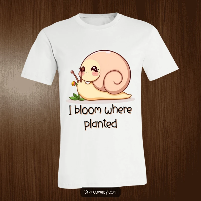 Funny playful snail nudging a tiny flower bud with its head on a soft t-shirt, a charming funny gift.